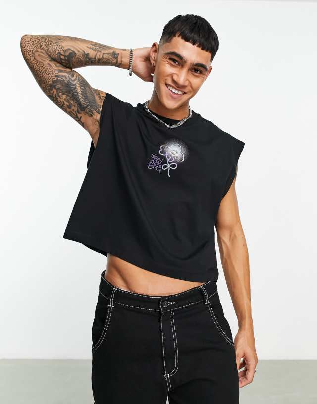 ASOS DESIGN oversized tank top in black with graphic flower chest print