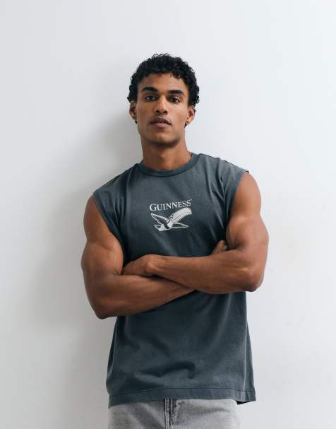 ASOS DESIGN oversized tank with Guinness print in Washed Black - view 1