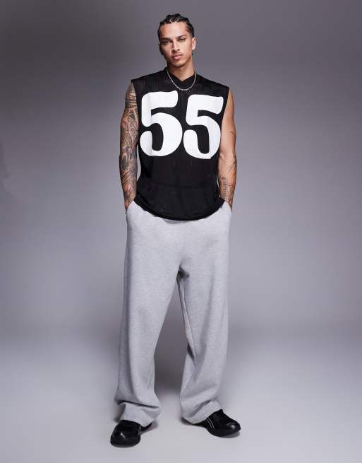 ASOS DESIGN oversized tank with sports graphic in black mesh