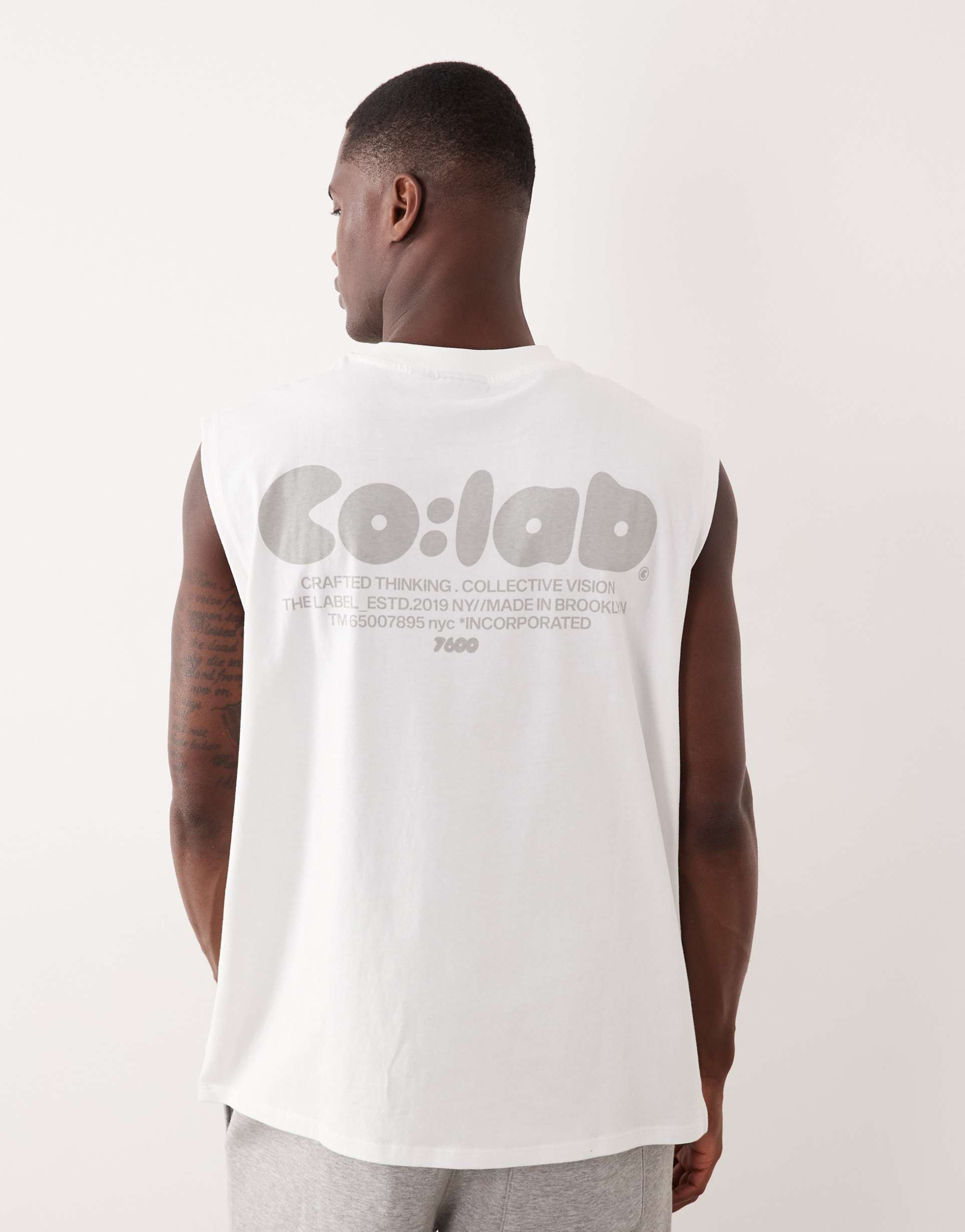ASOS DESIGN oversized tank with text print in white