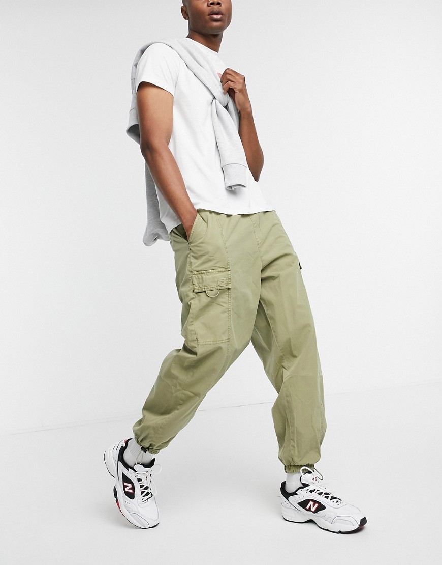 ASOS DESIGN oversized tapered cargo pants with wash in beige-Stone