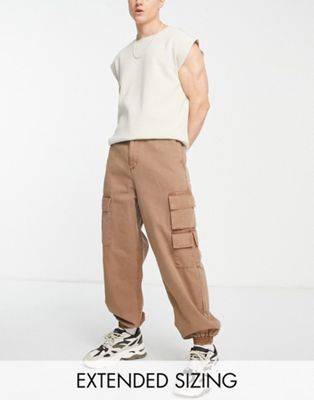 ASOS DESIGN oversized tapered cargo trousers in brown acid wash