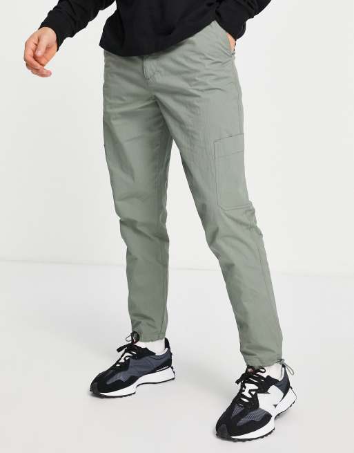 ASOS DESIGN oversized tapered cargo trousers in green