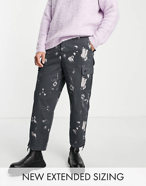 Men oversized tapered cargo trousers with bleach print 