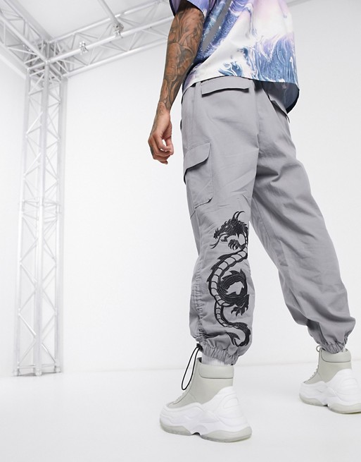ASOS DESIGN oversized tapered cargo trousers with dragon embroidery in grey