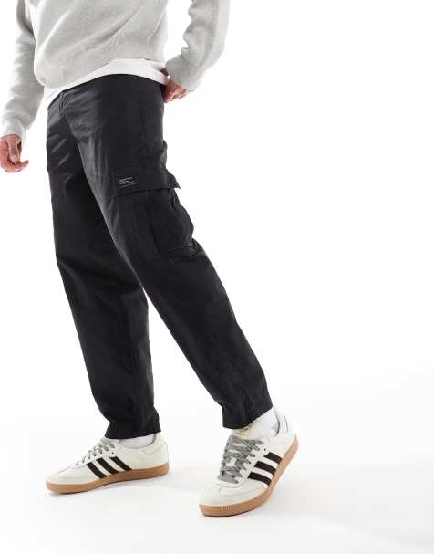 ASOS DESIGN oversized tapered cargo trousers with patch in black - view 1