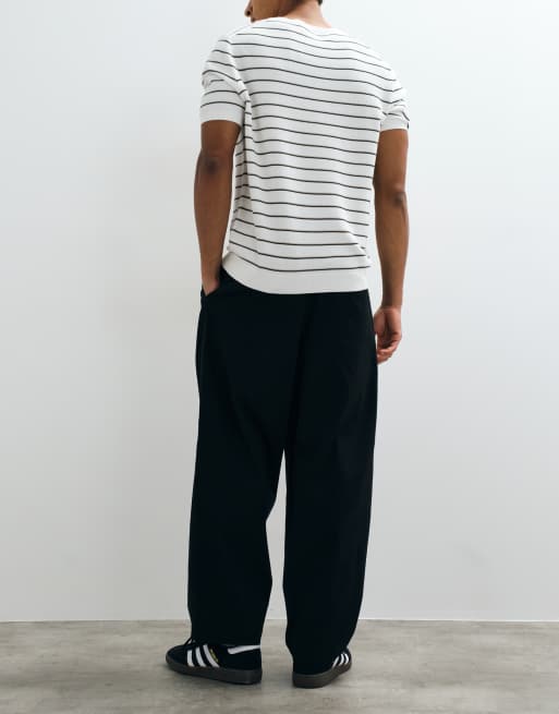 ASOS DESIGN oversized tapered chinos in black with inverted pleats, 2 of 10