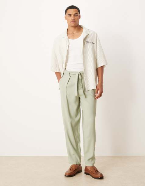ASOS DESIGN oversized tapered dress pants with belt detail in green - view 1