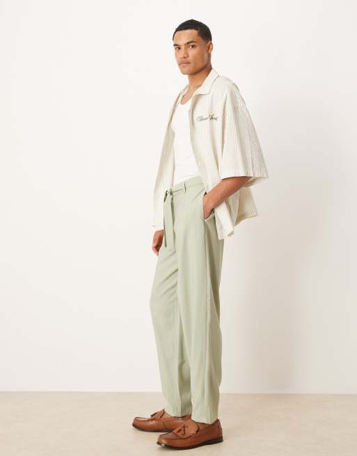 ASOS DESIGN oversized tapered dress pants with belt detail in green