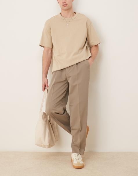 ASOS DESIGN oversized tapered dress pants with front pleats in dark stone - view 1