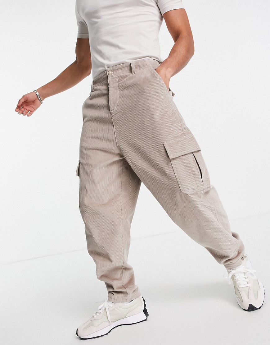 ASOS DESIGN oversized tapered fit pants with cargo pockets in cord-Neutral