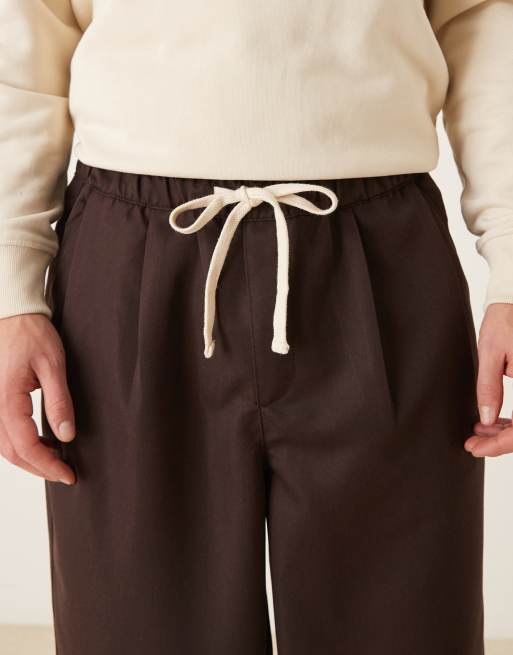 ASOS DESIGN oversized tapered fit pants with pleat detail in brown, 4 of 5