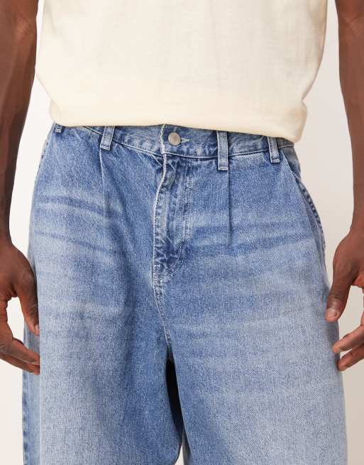 ASOS DESIGN oversized tapered jeans in light wash blue with pleats