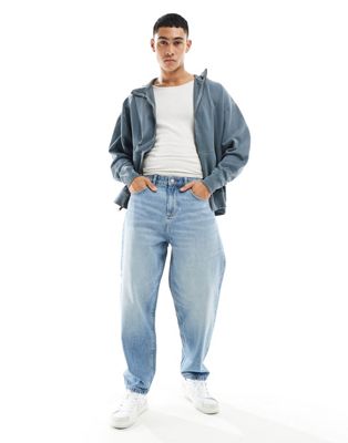 ASOS DESIGN oversized tapered jeans in mid wash blue