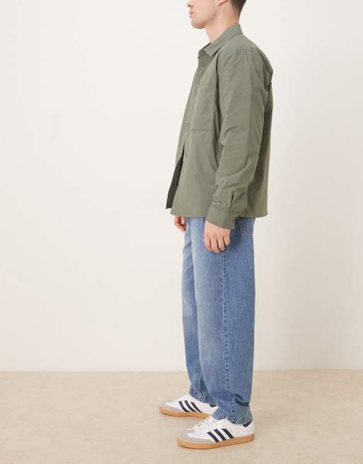 ASOS DESIGN oversized tapered jeans with pleat detail in midwash blue denim, 3 of 5