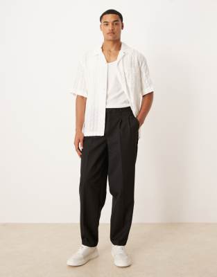 oversized tapered pants with double pleat in black