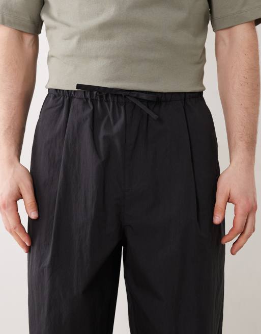 ASOS DESIGN oversized tapered pants with pleat in black techy fabric, 5 of 5