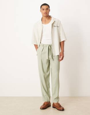 ASOS DESIGN oversized tapered smart pants with belt detail in green - view 1