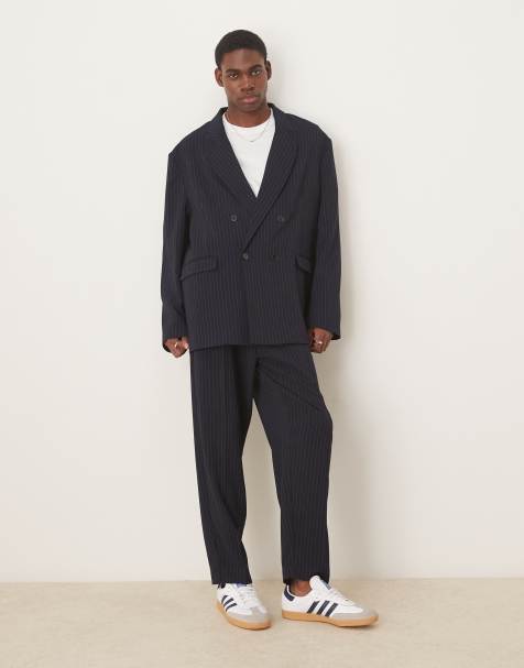 ASOS DESIGN oversized tapered suit trousers in navy pinstripe - view 1