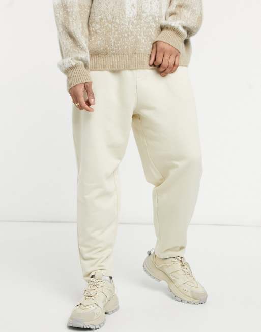 ASOS DESIGN oversized tapered sweatpants in beige | ASOS