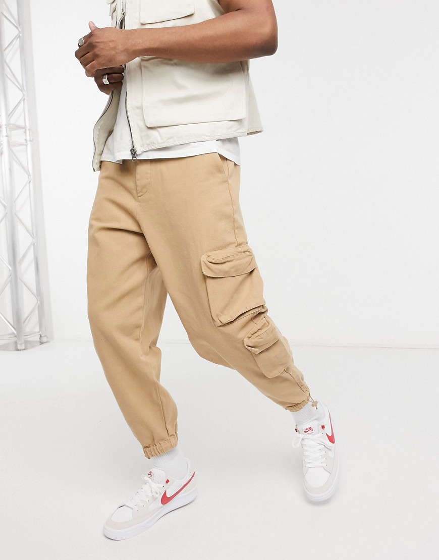 ASOS DESIGN oversized tapered sweatpants in heavy washed canvas-Neutral