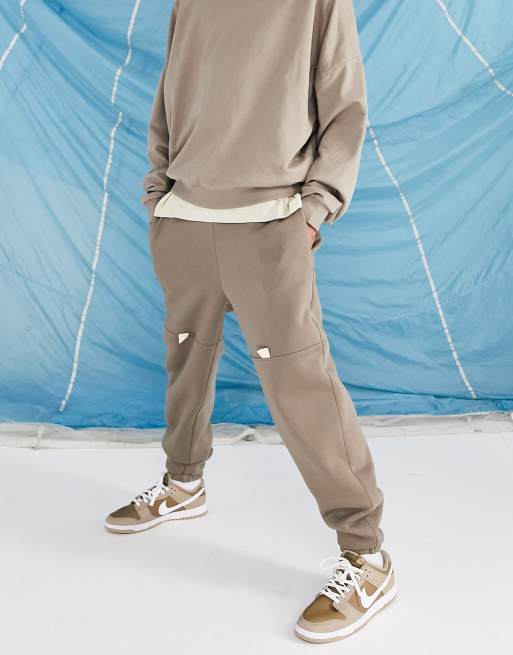 ASOS DESIGN oversized tapered trackies with knee detail in beige | ASOS