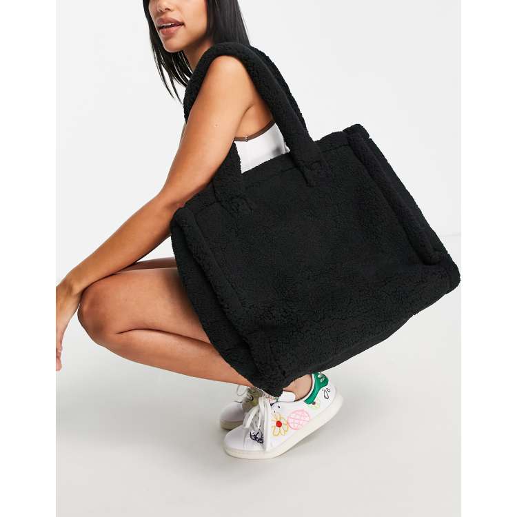 ASOS DESIGN oversized teddy borg tote bag in black - BLACK | ASOS