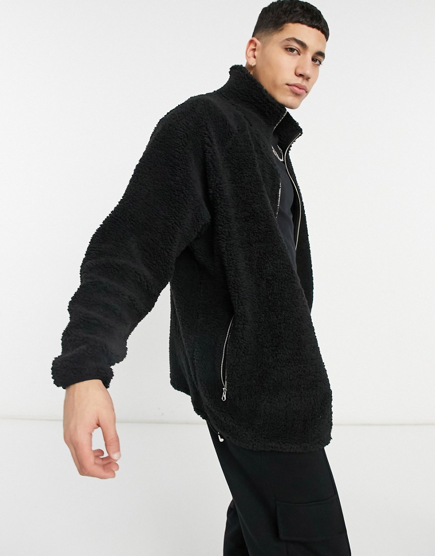 ASOS DESIGN oversized teddy track top with deep funnel in black