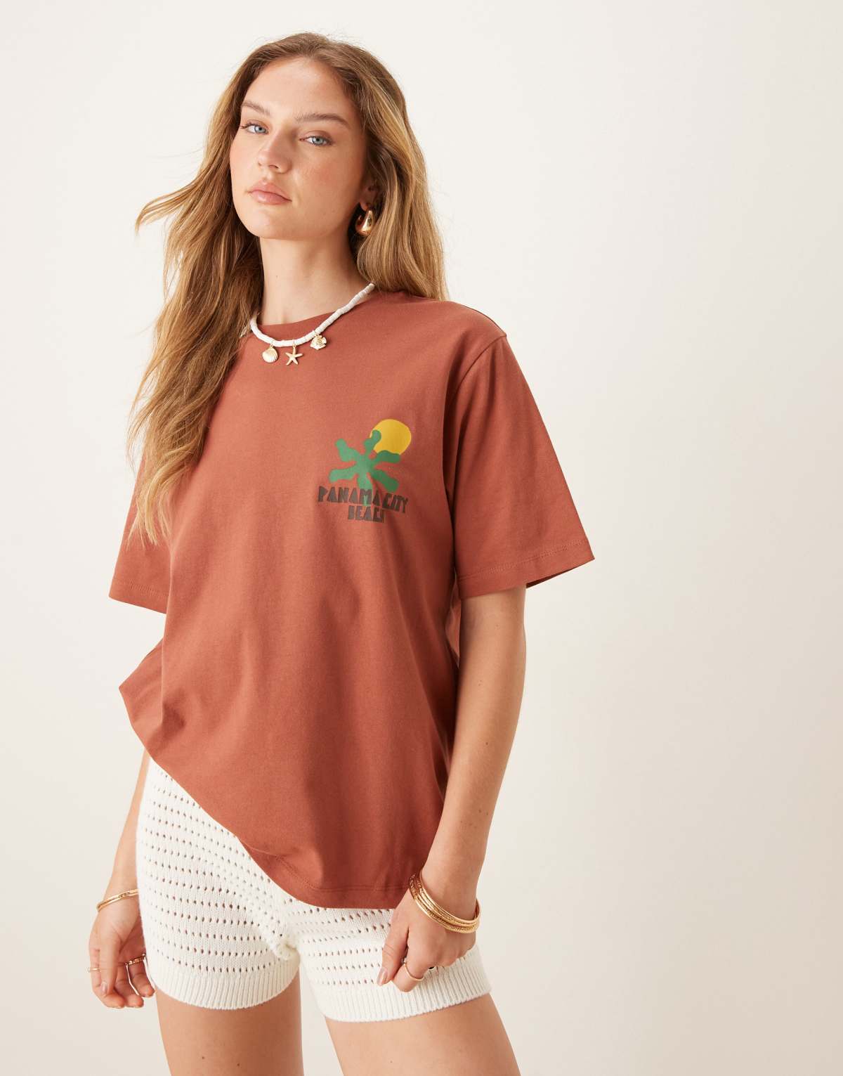 ASOS DESIGN oversized tee with abstract holiday graphic in rust