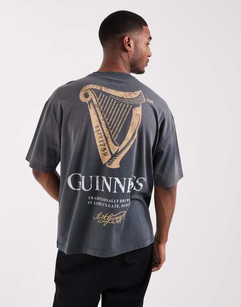 ASOS DESIGN oversized tee with Guinness print in washed black - view 1