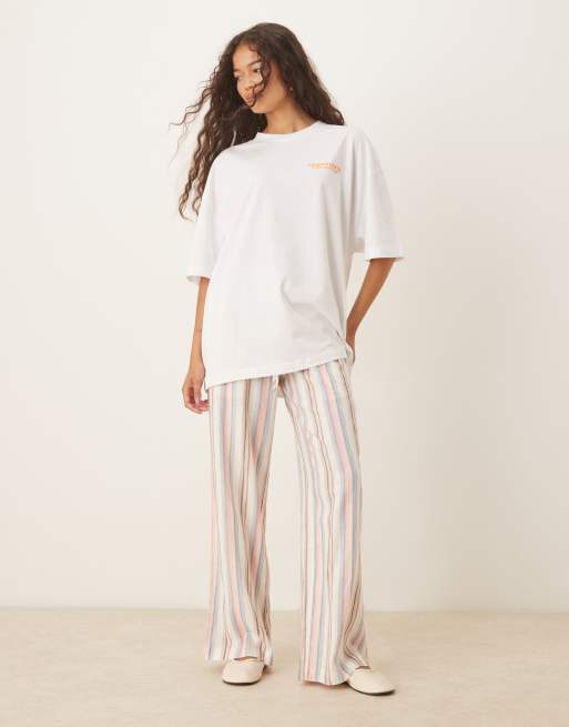 ASOS DESIGN oversized tee with orange back graphic in white