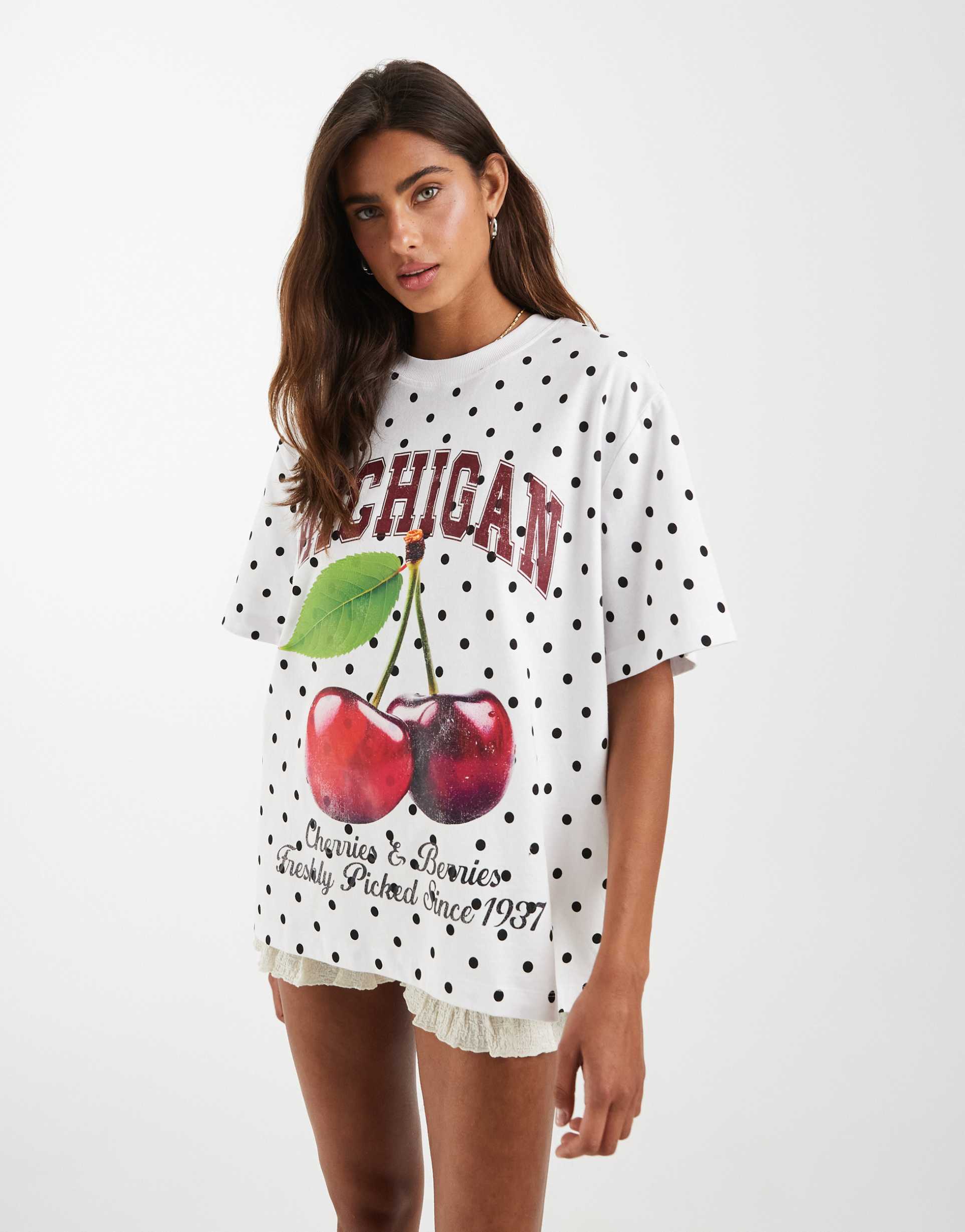 asos design oversized tee with slogan graphic in white polka dots