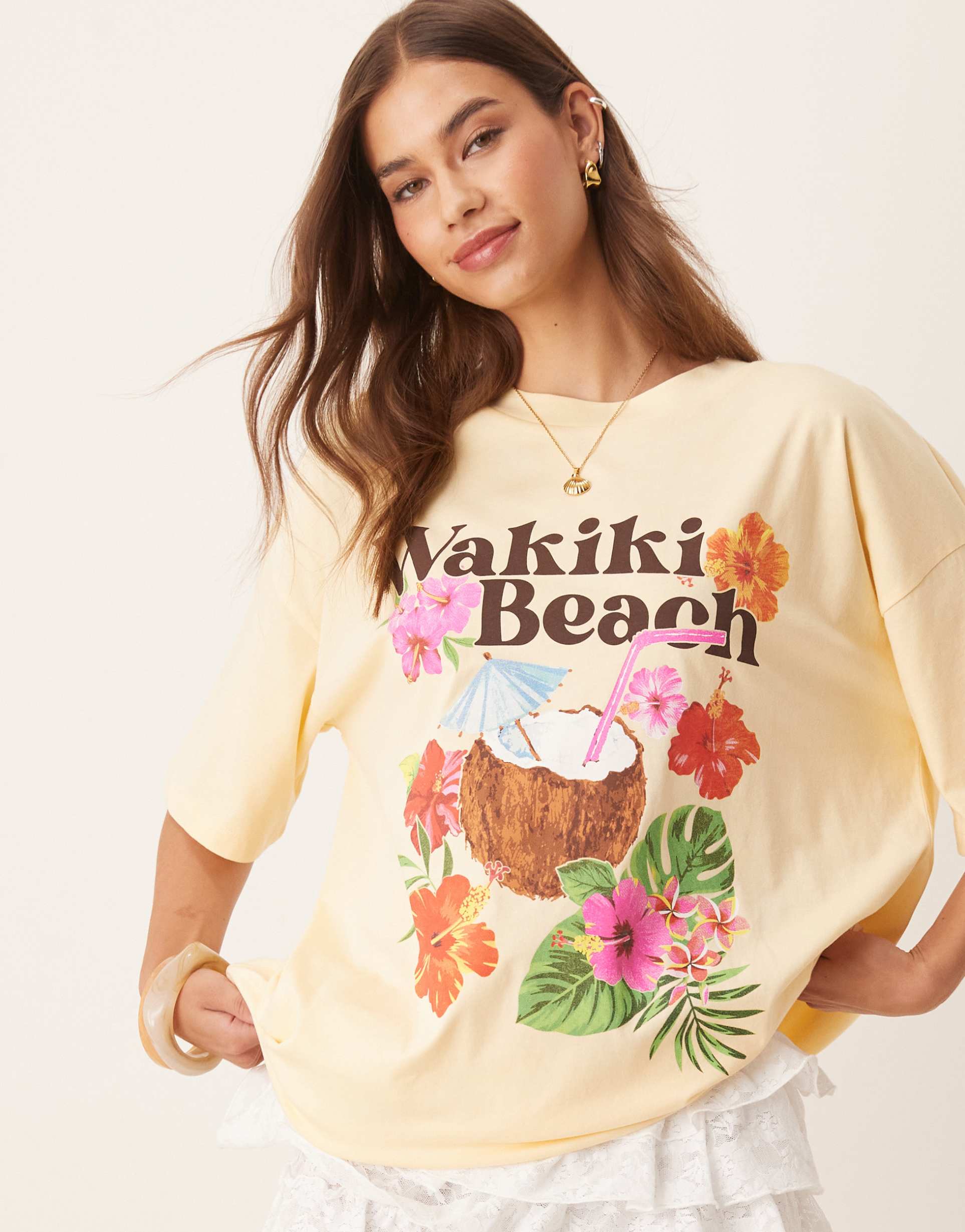 asos design oversized tee with tropical holiday graphic in buttermilk
