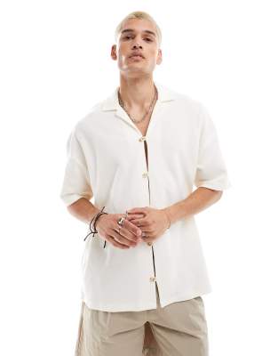 ASOS DESIGN oversized textured polo shirt in cream-White