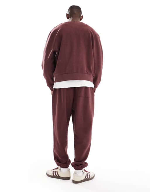 ASOS DESIGN oversized textured sweatpants in burgundy - part of a set