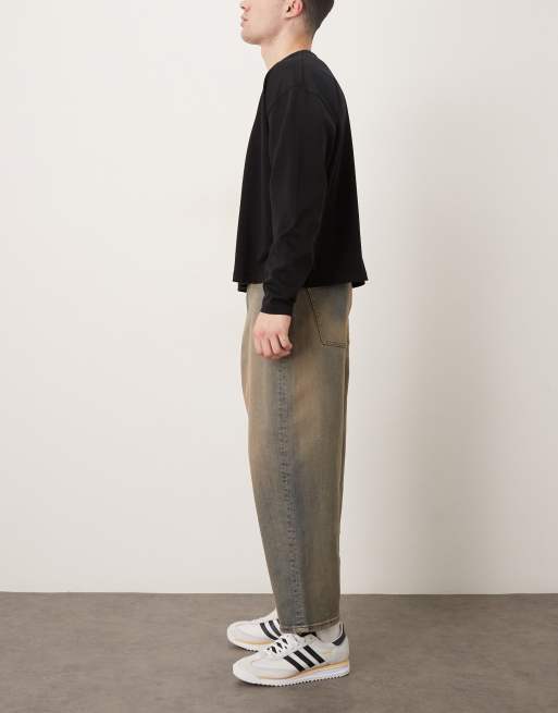 ASOS DESIGN - Oversized toelopende jeans in mid-wash blauw met bruine tint, 2 van 5