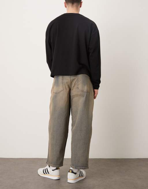 ASOS DESIGN - Oversized toelopende jeans in mid-wash blauw met bruine tint, 3 van 5