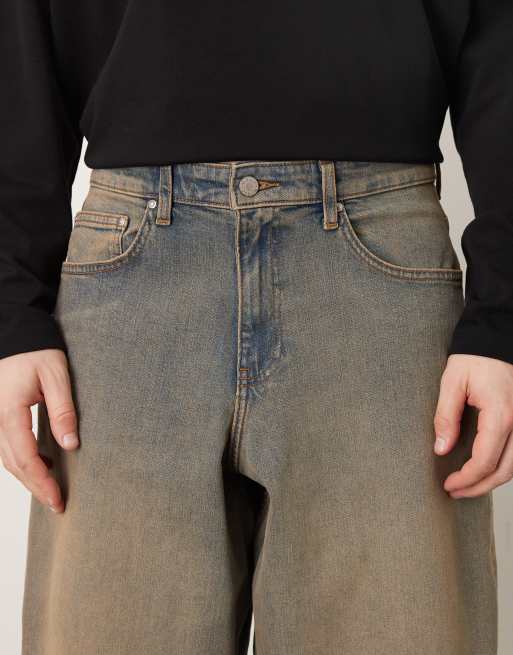 ASOS DESIGN - Oversized toelopende jeans in mid-wash blauw met bruine tint, 4 van 5