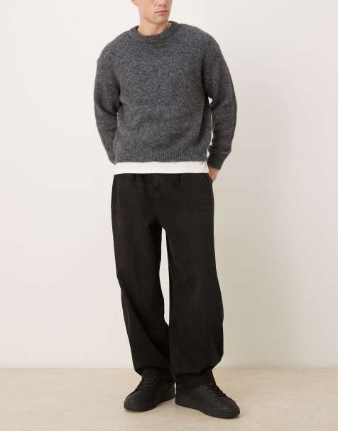 ASOS DESIGN - Oversized toelopende jeans met plooien in zwart - view 1