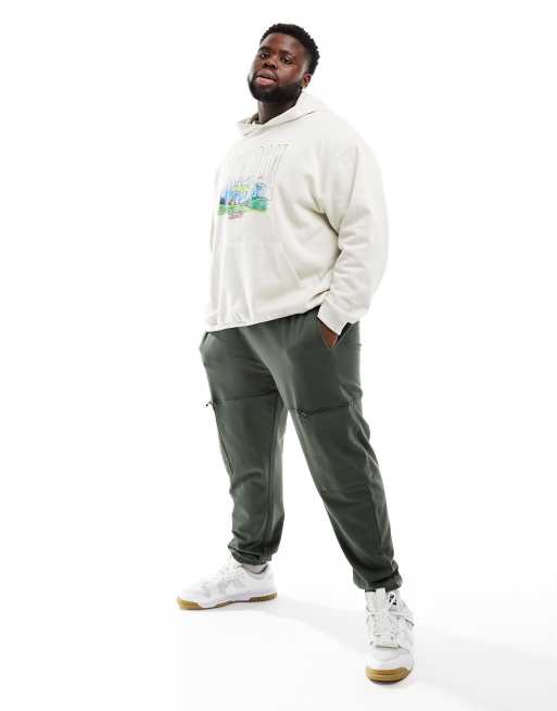 ASOS DESIGN - Oversized toelopende joggingbroek met cargozakken in donkergroen, 4 van 5