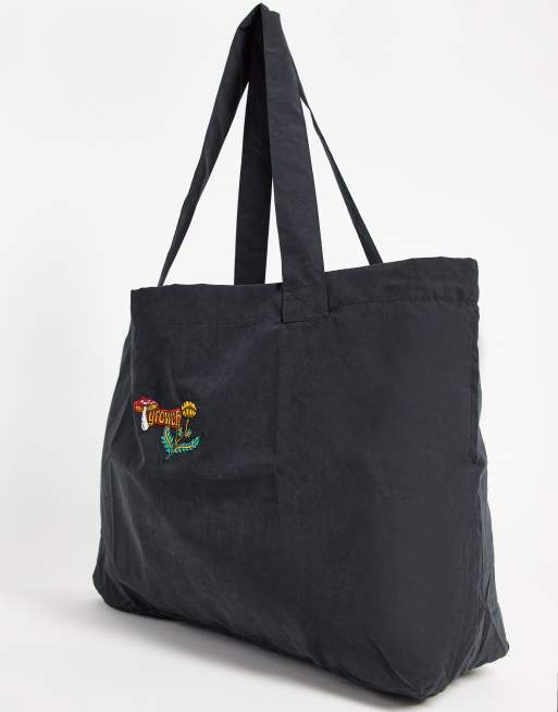 ASOS DESIGN oversized tote bag in soft touch black cotton with mushroom embroidery