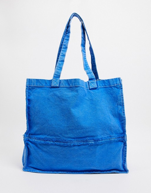 ASOS DESIGN oversized tote bag with raw edges in washed blue