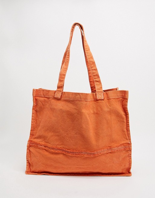 ASOS DESIGN oversized tote bag with raw edges in washed orange
