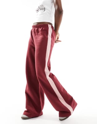 oversized track pants with pink side stripe in burgundy-Multi