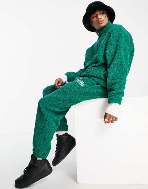 ASOS DESIGN oversized trackies in green borg with collegiate embroidery (part of a set)