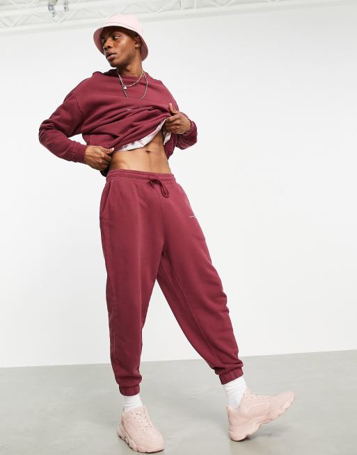 ASOS DESIGN oversized trackies in washed burgundy cotton with text print (part of a set) - RED
