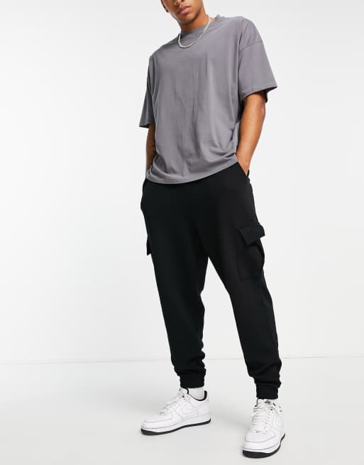ASOS DESIGN oversized trackies with cargo pockets in black, 3 of 4