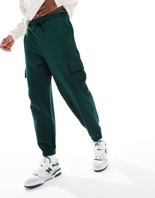 ASOS DESIGN oversized trackies with cargo pockets in dark green