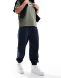 ASOS DESIGN oversized trackies with piping in navy