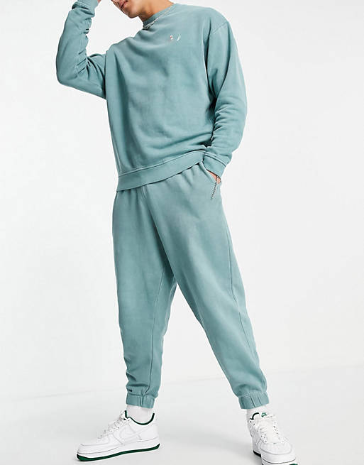 Men oversized tracksuit in green acid wash with line drawing logo 